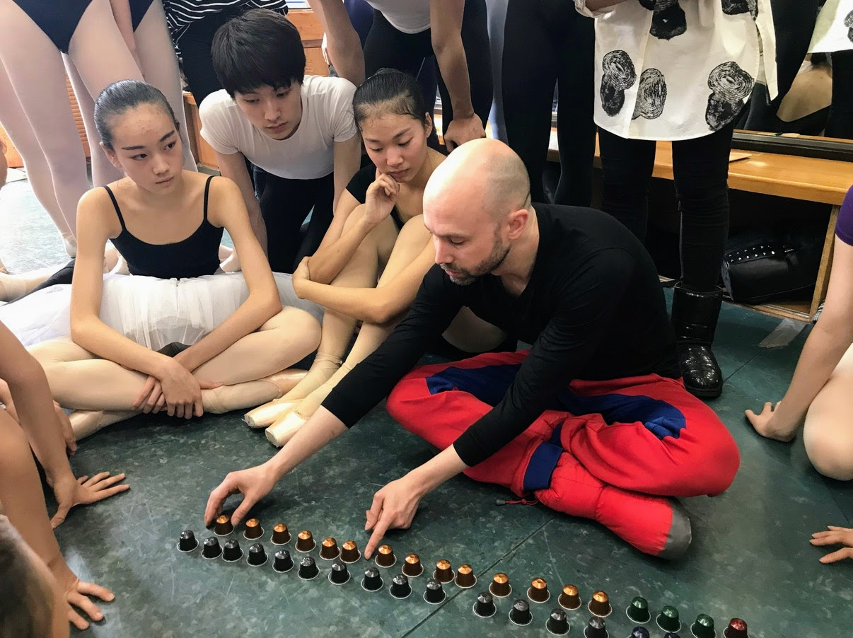 Peter Quanz planning spatial formations with Nespresso capsules, Jupiter Symphony, Beijing Dance Academy, 2018